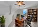 Upstairs office features a wood desk and bookshelf along with a window for natural light at 3975 N Hualapai Way # 235, Las Vegas, NV 89129
