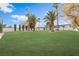 The expansive lawn is well-manicured and features mature landscaping and trees at 401 Lacy Ln, Las Vegas, NV 89107
