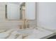 Close-up of a bathroom sink with gold hardware, granite countertop, and bright lighting at 401 Lacy Ln, Las Vegas, NV 89107