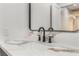Close up on marble counters and matte black faucet and hardware in remodeled bathroom at 401 Lacy Ln, Las Vegas, NV 89107