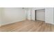 This bedroom boasts wood-look flooring, a closet, and neutral walls at 401 Lacy Ln, Las Vegas, NV 89107
