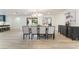 Elegant dining room with stylish lighting, seating for eight, and contemporary furnishings at 401 Lacy Ln, Las Vegas, NV 89107