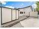 View of driveway and extra storage unit with house in the background at 401 Lacy Ln, Las Vegas, NV 89107