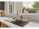 Close-up of the kitchen sink with a sleek faucet and modern countertop at 401 Lacy Ln, Las Vegas, NV 89107