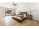 Large main bedroom with a sliding glass door to pool area, plenty of natural light at 401 Lacy Ln, Las Vegas, NV 89107