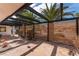 Charming tiled patio with wooden privacy screen and overhead pergola at 401 Lacy Ln, Las Vegas, NV 89107