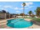 Relaxing backyard oasis with sparkling pool, well-manicured lawn, and ample patio space at 401 Lacy Ln, Las Vegas, NV 89107