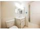 Simple bathroom with white vanity and toilet with ensuite bathroom at 4032 Great Plains Way, Las Vegas, NV 89121