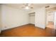 Large bedroom with ceiling fan, closet and door to hallway at 4032 Great Plains Way, Las Vegas, NV 89121