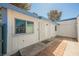 Exterior view showcasing a white trimmed patio entry and brickwork at 4032 Great Plains Way, Las Vegas, NV 89121