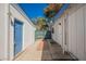 Exterior view showcasing access between the units with brick walkway at 4032 Great Plains Way, Las Vegas, NV 89121