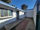 Exterior showcasing access to a quaint courtyard entry at 4032 Great Plains Way, Las Vegas, NV 89121