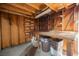 Garage with wooden walls, storage shelves, workbench, and ample space for projects and organization at 4032 Great Plains Way, Las Vegas, NV 89121