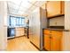 Cozy kitchen with wooden cabinets, laminate countertops, and stainless steel refrigerator at 4032 Great Plains Way, Las Vegas, NV 89121