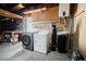 A functional laundry area with washer, dryer, and water heater at 4032 Great Plains Way, Las Vegas, NV 89121