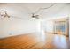 A spacious living room with hardwood floors and access to the backyard at 4032 Great Plains Way, Las Vegas, NV 89121