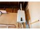 Close-up of a modern, wall-mounted tankless water heater for efficient hot water on demand at 4032 Great Plains Way, Las Vegas, NV 89121
