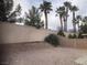 The backyard has stone and brick walls, as well as gravel ground cover at 405 Center Green Dr, Las Vegas, NV 89148