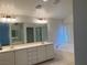 Bathroom with double sinks, lots of counter space, a soaking tub, and bright vanity lighting at 405 Center Green Dr, Las Vegas, NV 89148