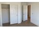 Bedroom featuring a closet with sliding doors and a doorway to another area at 405 Center Green Dr, Las Vegas, NV 89148