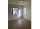 Bedroom with two windows offering an abundance of natural light and wood-look flooring at 405 Center Green Dr, Las Vegas, NV 89148