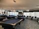 Billiard room with several pool tables and seating at 405 Center Green Dr, Las Vegas, NV 89148