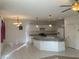 Bright kitchen featuring white cabinets, tile flooring, stainless steel appliances, and an island at 405 Center Green Dr, Las Vegas, NV 89148