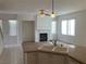The open living area features a modern fireplace, tile flooring and lots of natural light at 405 Center Green Dr, Las Vegas, NV 89148