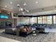 Lobby area with modern furnishings, fireplace, and large windows offering views of the community at 405 Center Green Dr, Las Vegas, NV 89148