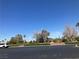 Street view with well-manicured landscaping and a glimpse of the neighborhood's tranquil setting at 405 Center Green Dr, Las Vegas, NV 89148