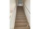 An interior view of the home's wooden stairway with white banisters at 405 Center Green Dr, Las Vegas, NV 89148