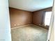 A carpeted bedroom featuring neutral walls and a window at 45 Maleena Mesa St # 1921, Henderson, NV 89074