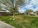 Landscaped community park featuring a green lawn, mature trees, and a covered gazebo with picnic tables near residential homes at 45 Maleena Mesa St # 1921, Henderson, NV 89074