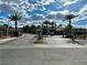 Gated entrance to the community with palm trees and well-maintained landscaping at 45 Maleena Mesa St # 1921, Henderson, NV 89074