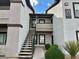 Condo exterior with stairs leading to unit, desert landscaping, and building number at 45 Maleena Mesa St # 1921, Henderson, NV 89074