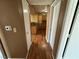 A hallway with hardwood floors leads to the kitchen at 45 Maleena Mesa St # 1921, Henderson, NV 89074