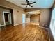 Bright living room with ceiling fan, hardwood floors, and neutral color palette at 45 Maleena Mesa St # 1921, Henderson, NV 89074