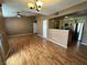 Open concept living space with hardwood floors, ceiling fan, and kitchen view at 45 Maleena Mesa St # 1921, Henderson, NV 89074