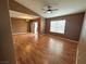 Spacious living room with hardwood floors, a ceiling fan, and natural light at 45 Maleena Mesa St # 1921, Henderson, NV 89074