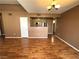 Open-concept living space with hardwood floors and views into the kitchen at 45 Maleena Mesa St # 1921, Henderson, NV 89074