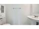 Modern half-bathroom with pedestal sink and storage cabinet at 4727 Agave Cactus St, North Las Vegas, NV 89031