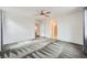 Bedroom with neutral carpet, ample natural light, and a ceiling fan at 4727 Agave Cactus St, North Las Vegas, NV 89031