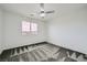 Bedroom with large window and plush patterned carpet at 4727 Agave Cactus St, North Las Vegas, NV 89031