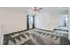 This bedroom boasts natural light, a contemporary ceiling fan, and neutral paint for a modern look at 4727 Agave Cactus St, North Las Vegas, NV 89031