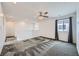 Upstairs bonus room features neutral paint, contemporary ceiling fan, and lots of natural light at 4727 Agave Cactus St, North Las Vegas, NV 89031