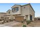 Charming home featuring a two-car garage, brick driveway, stylish shutters, and xeriscaping at 4727 Agave Cactus St, North Las Vegas, NV 89031