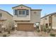 Charming home featuring a two-car garage, brick driveway, stylish shutters, and manicured landscaping at 4727 Agave Cactus St, North Las Vegas, NV 89031