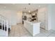 Modern kitchen featuring an island with a sink and a view of the stairway to the second floor at 4727 Agave Cactus St, North Las Vegas, NV 89031