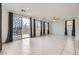 Spacious living room with tile floors, slider to the backyard, and multiple windows at 4727 Agave Cactus St, North Las Vegas, NV 89031