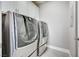 Well-lit laundry room with front-load washer and dryer at 5 Via Vita Bella, Henderson, NV 89011